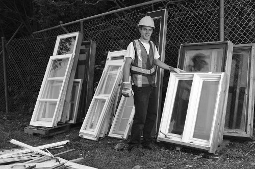 Man unloading old furniture for disposal in East London